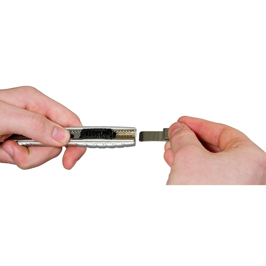 STANLEY 0-10-411 utility knife with blade replacement shown in hand close-up, photography