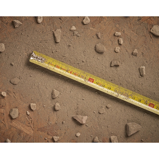 STANLEY 0-33-522 tape measure photography on dusty surface with scattered rocks