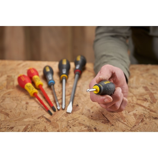 STANLEY 0-65-407 screwdriver set on wood surface, close-up front angle with one screwdriver held in hand.