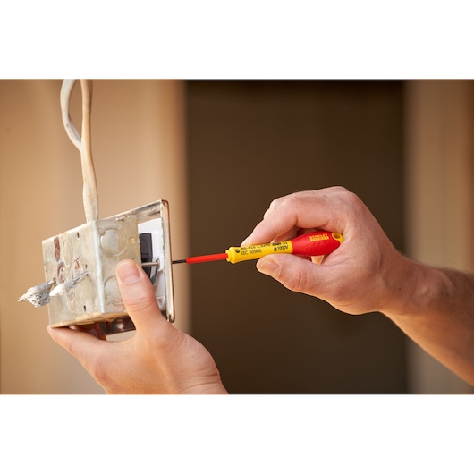 Photo of STANLEY 0-65-410 insulated screwdriver used on electrical junction box.