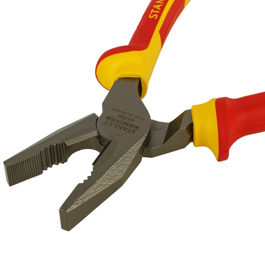 STANLEY 0-84-002 insulated combination pliers, red and yellow handles, close-up white background.