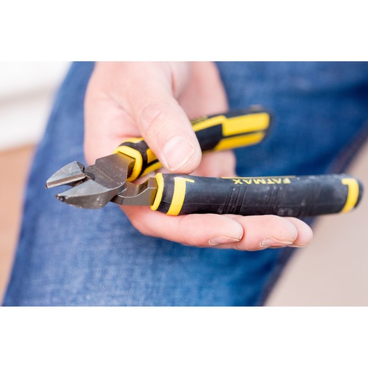 Photo of STANLEY 0-89-858 diagonal cutting pliers with black and yellow handle, held in hand.