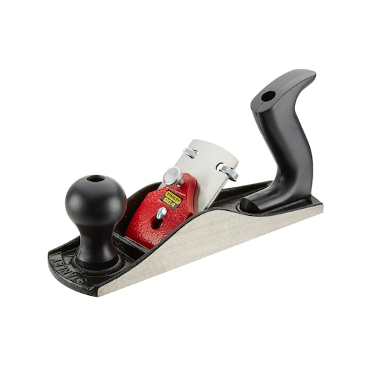 STANLEY 1-12-034 hand planer with black handles, red cap, and metal base, side angle on white background.