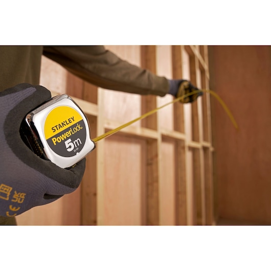 Photo of STANLEY 1-33-191 PowerLock 5m tape measure being used for wall framing.