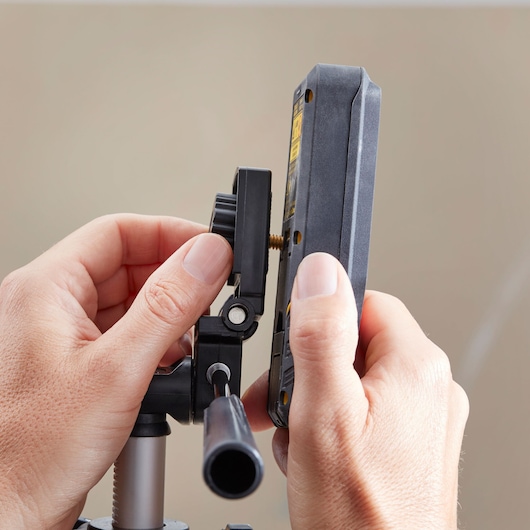 STANLEY 1-77-201 tripod mount photography accessory held in hands, close-up view.