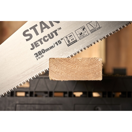 STANLEY 2-15-281 saw blade close-up cutting wood, showing JetCut 380mm/15in with sharp triple ground teeth.