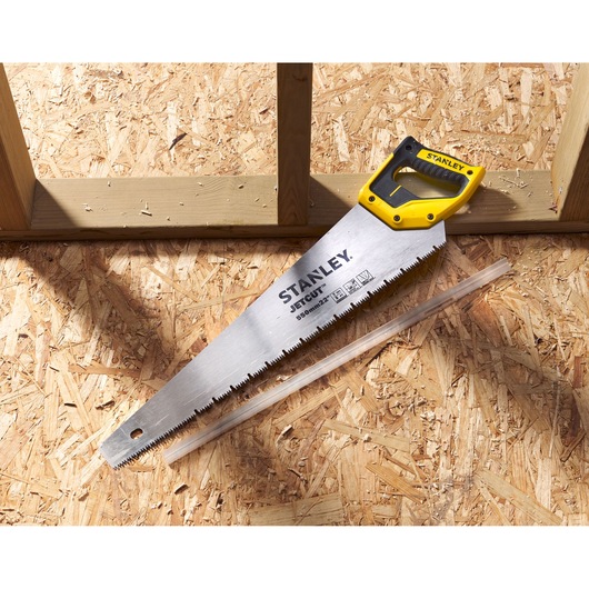 STANLEY 2-20-037 hand saw with yellow and black handle on wood panel, blade marked JETCUT 550mm.