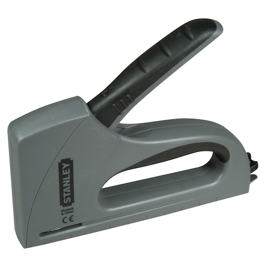 Photo of STANLEY 6-TR40 hand staple gun, grey and black, side view on white background, photography category.