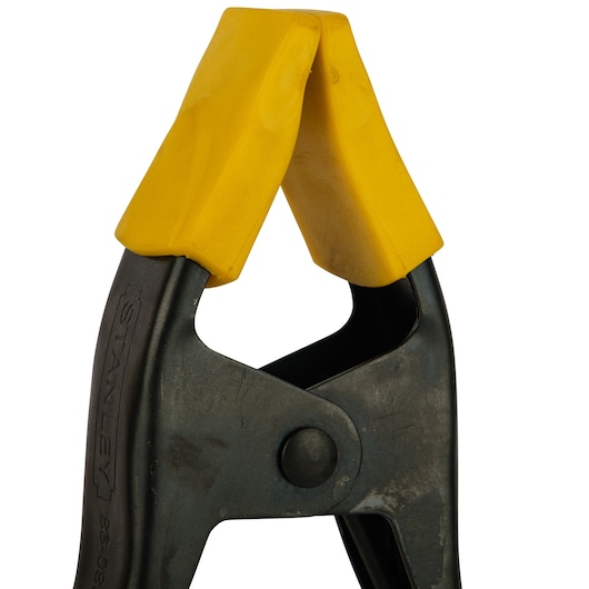 STANLEY 9-83-080 photography of metal clamp with yellow plastic jaws, close-up on white background.