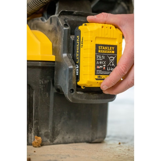 Photo of STANLEY FMC795B 18V lithium battery being attached to a power tool.