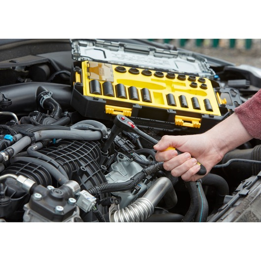 STANLEY FMHT0-74714 socket set used in car engine maintenance, case open showing various sockets.