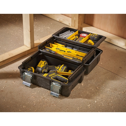 STANLEY FMST1-71219 black tool box with compartments, filled with yellow tools, photography at workshop.