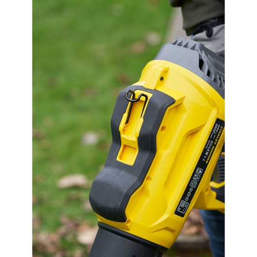 STANLEY SFMCBL7M1 yellow and black blower close-up outdoors, side angle.