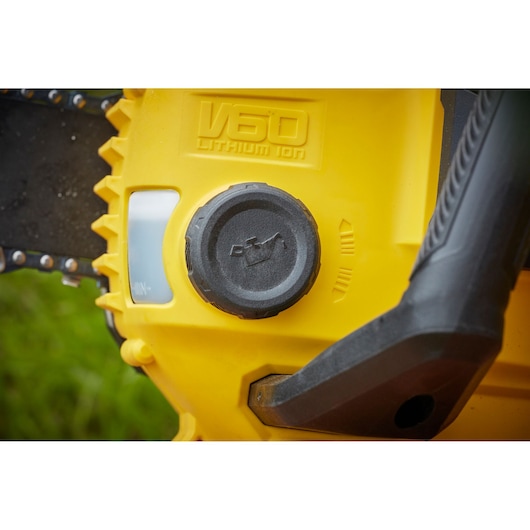 STANLEY SFMCCSB664B chainsaw close-up showing yellow body, oil cap, and V60 Lithium Ion label.
