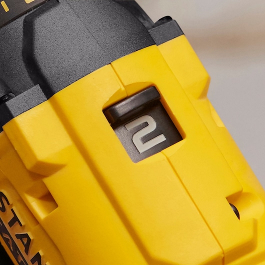 STANLEY SFMCD700C2K yellow drill close-up showing speed selector in position two.