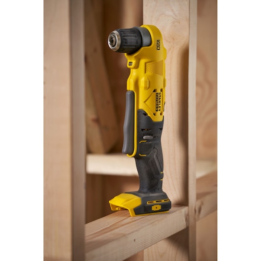 Photo of STANLEY SFMCD750D2K cordless right angle drill placed on wooden framing.