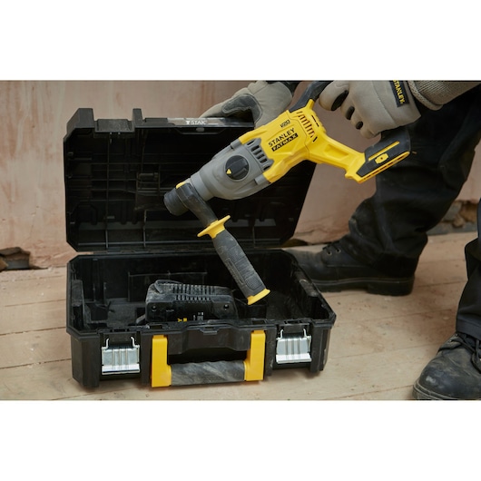STANLEY SFMCH900M22 cordless rotary hammer drill in a black and yellow case, shown from a front angle.