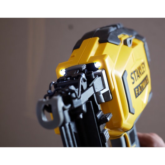 STANLEY SFMCN616B cordless nailer close-up showing LED lights and yellow housing.
