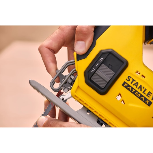 Photo of STANLEY SFMCS600M2K jigsaw close-up showing blade installation and yellow FATMAX housing.