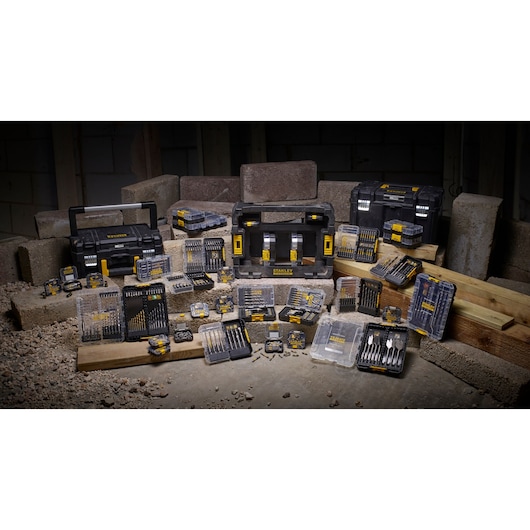 STANLEY STA88558 toolkit set with drill bits, cases, and toolboxes arranged on construction site.