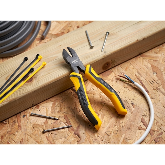 STANLEY STHT0-74362 diagonal cutting pliers with yellow and black handles on a workbench.