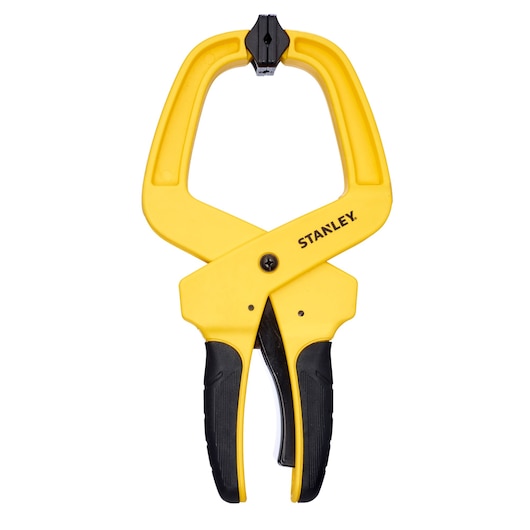 Stanley yellow and black spring clamp tool, suitable for holding materials securely during photography projects.