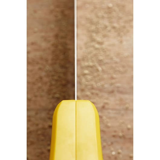 STANLEY STHT20349-1 hand saw with yellow handle, close-up view from top showing blade alignment.
