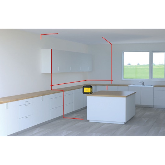 STANLEY STHT77502-1 laser level on kitchen island, projecting red lines in modern white kitchen, front angle.