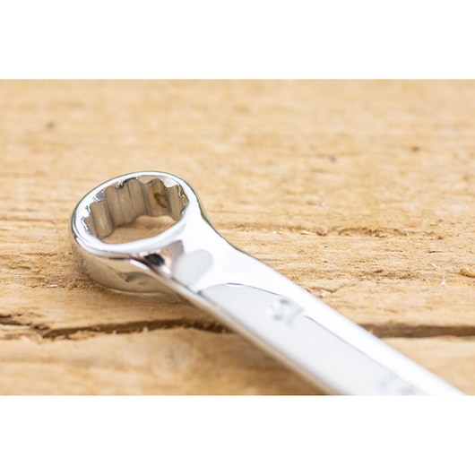 STANLEY STMT82843-0 chrome box-end wrench, tool category, close-up photo on wood surface.