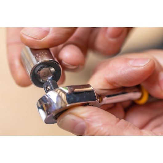 STANLEY STMT86103-0 socket wrench being fitted with a socket, close-up, product photography.