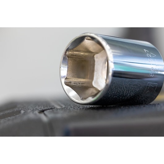STANLEY STMT86103-0 chrome socket close-up on black surface, photography angle from side.
