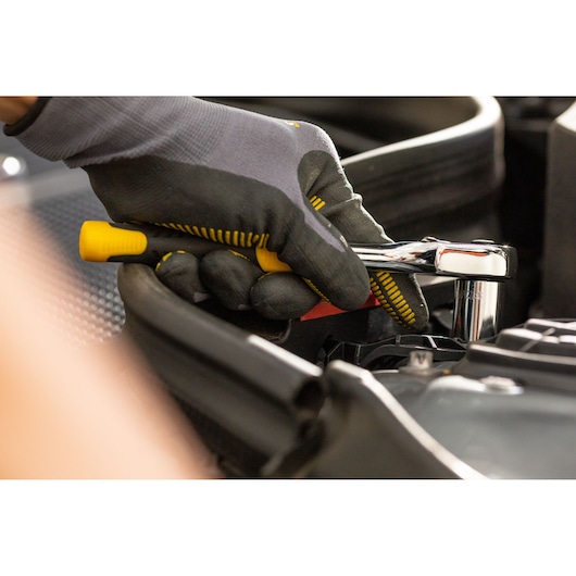 STANLEY STMT86316-0 ratchet wrench in use, close-up, automotive context, photography.