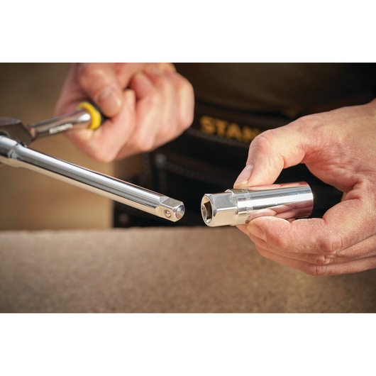 STANLEY STMT88941-0 socket and ratchet tool held in hands, close-up photography with yellow handle.