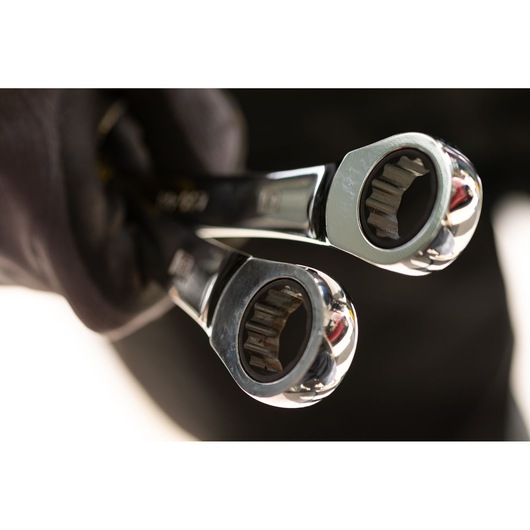 STANLEY STMT89913-0 ratcheting wrenches held in gloved hand, close-up photography of tool heads.