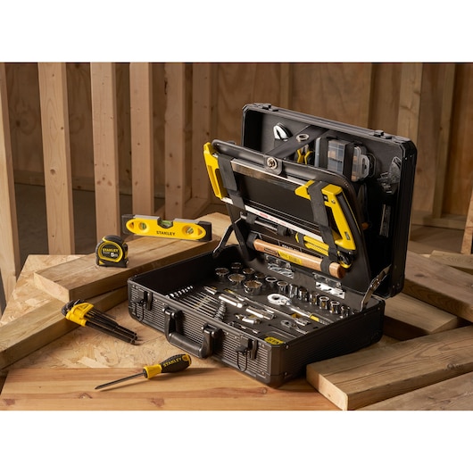 STANLEY STMT98109-1 maintenance suitcase with 142 PCS tools shown open on wood planks, featuring hand tools.