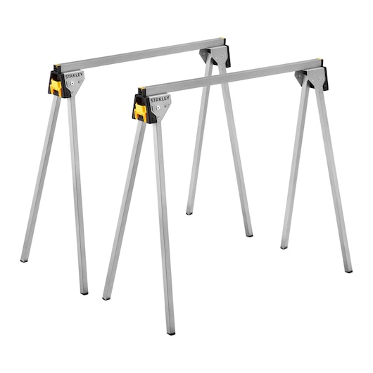 STANLEY STST81337-1 metal folding sawhorse set, silver with yellow accents, angled on white background.