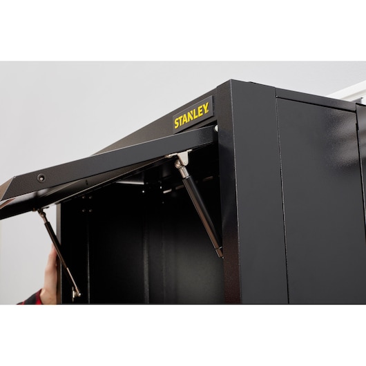 STANLEY STST97599-1 black metal storage cabinet with gas struts, front angle, door partially open.